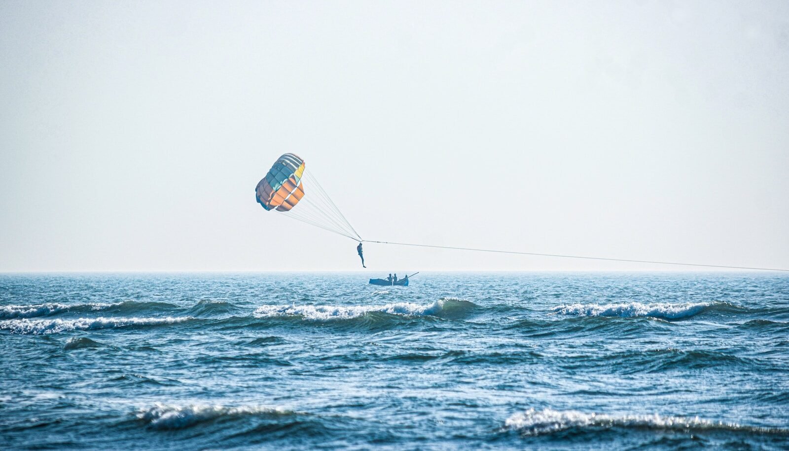 Home person surfing on sea during daytime